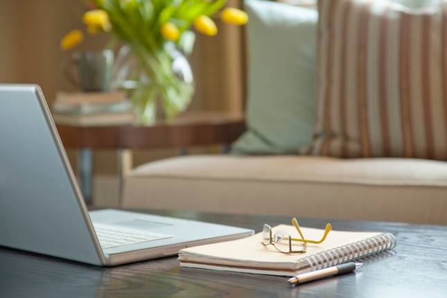 Laptop on coffee table --- Image by © Kate Kunz/Corbis